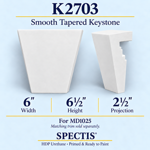 K2703 smooth tapered keystone in primed HDP urethane, front and side profile views; 6 inch W x 6½ inch H x 2½ inch P