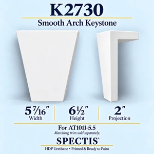 K2730 smooth arch keystone in primed HDP urethane, front and side profile views; 5 7/16 inch W x 6½ inch H x 2 inch P