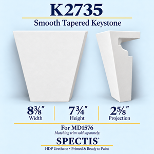 K2735 smooth tapered keystone in primed HDP urethane, front and side profile views; 8⅜ inch W x 7¾ inch H x 2⅝ inch P
