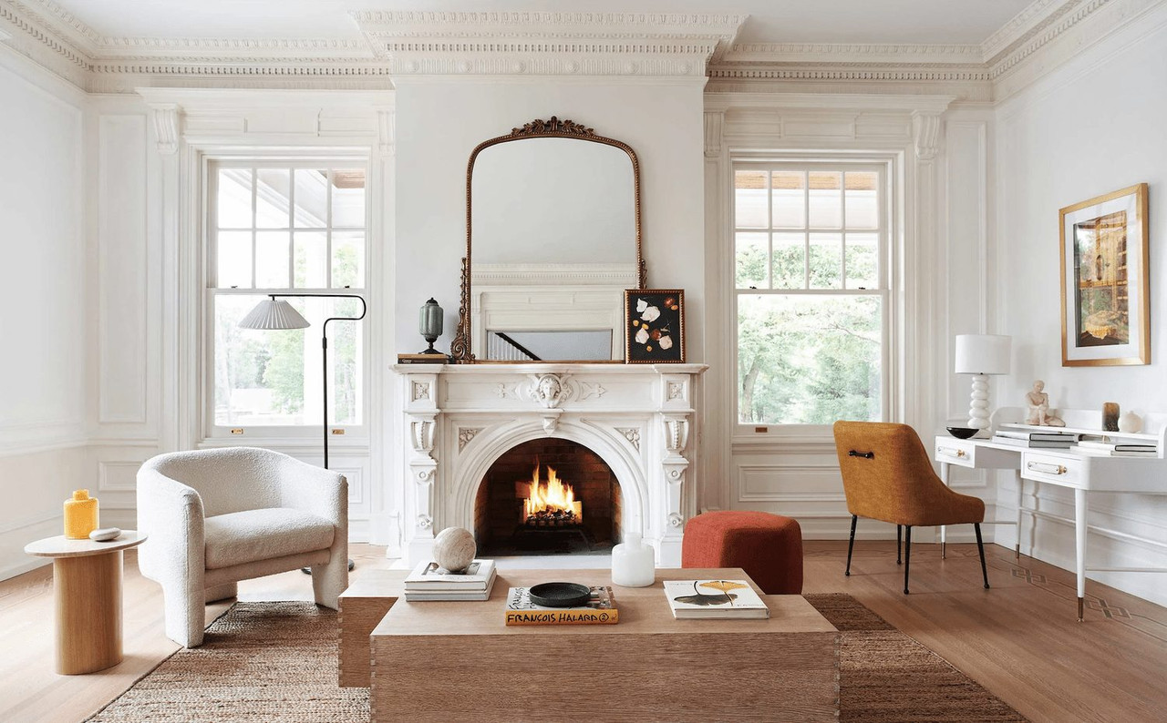 Living room with crown moulding, a fireplace, and tall windows