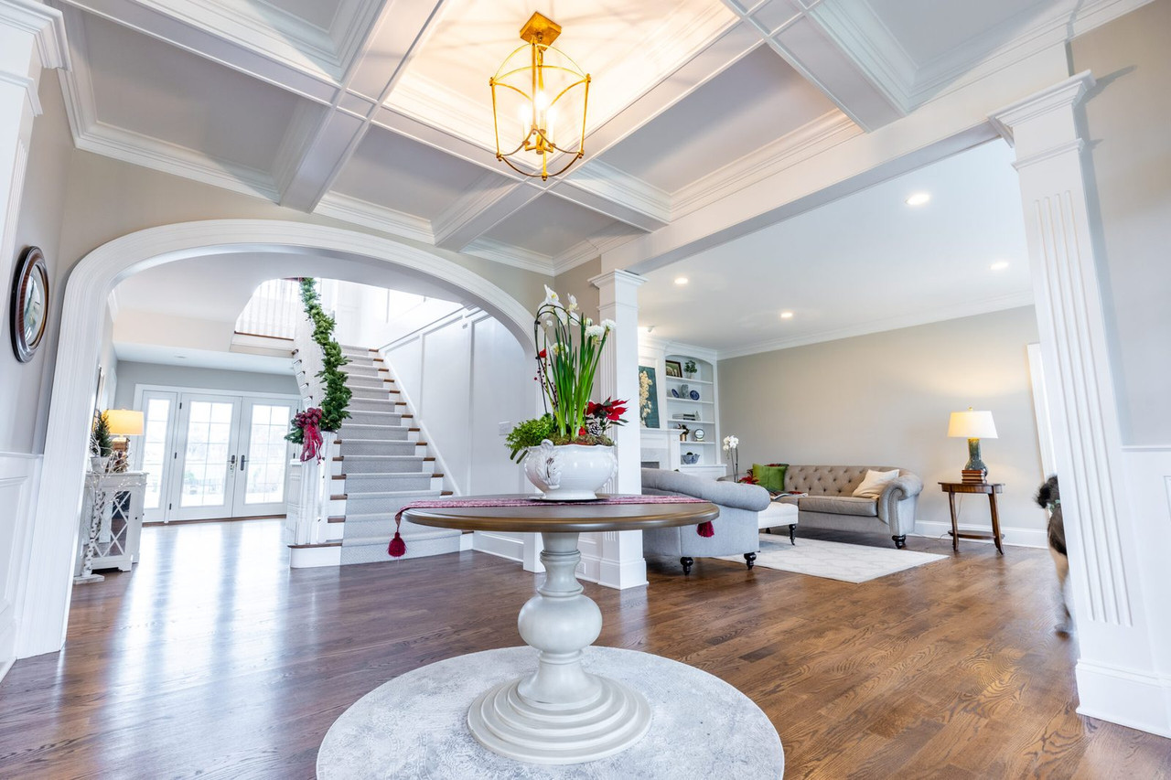Entry with a coffered ceiling and columns