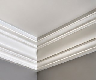 White crown moulding where an interior wall meets the ceiling