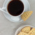 Walker's Shortbread Triangles served with cup of coffee