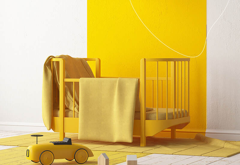 Kinderkamer geschilderd met een gele muurverf.
