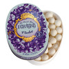“Flavigny Violet pastilles in a purple vintage tin with a floral French countryside illustration.”