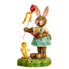 bunny figurine with songbook and egg wand beside chick