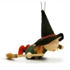 green‑clad witch figurine flying on a broom with pointed hat and yarn hair