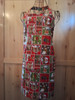 Holiday patchwork apron with winter motifs and matching neck loop and ties.