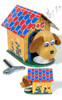 Vintage tin dog house wind‑up toy with plush golden pup eating from dish
