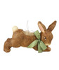 “Whimsical vintage papier mâché Easter figure with ribbon accents in a soft, storybook style.”