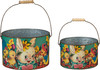 Two vintage‑inspired Easter buckets with bunny, lamb, and chick artwork, featuring metal handles and rustic spring designs.