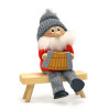 nisse with accordion sitting figure with gray knit hat and hanging string