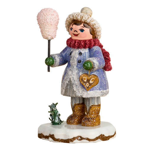 winter child figurine holding cotton candy with small tree on snowy base