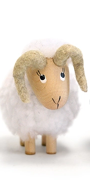 white nordic dreams ram with wooden face, curved horns, and fluffy faux‑wool coat