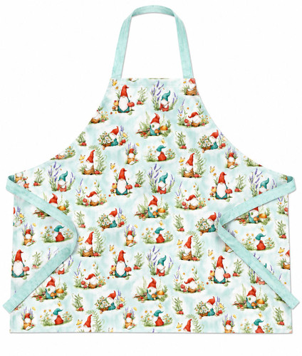Light green apron with an all‑over gnome, mushroom, flower, butterfly, and pumpkin pattern with darker green straps and head loop.