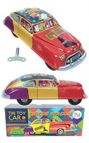 Vintage tin circus wagon with clowns and animal figures, featuring rubber wheels and friction motor