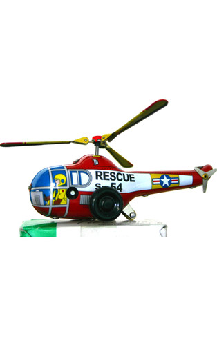 Small vintage tin helicopter wind‑up toy with spinning blades