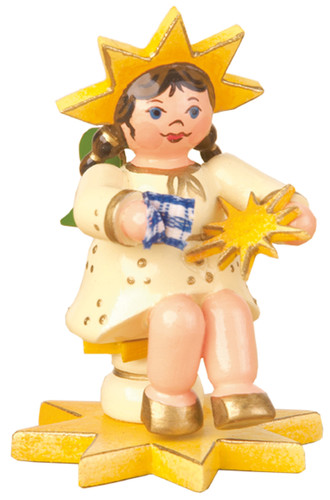 hubrig star child figurine polishing a star with a small cloth