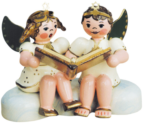 Two hand‑painted wooden angels from Hubrig’s Angels of Heaven collection, sharing and reciting the Christmas story.