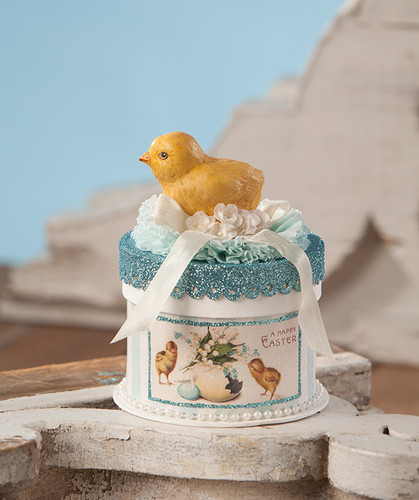 easter chick figure standing on pressed paper box with crepe paper ribbon glitter pearls and floral accents