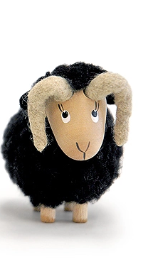 black nordic dreams ram with wooden face, curved horns, and faux‑wool coat