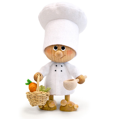 chef nisse figurine with white hat, wooden spoon, and basket of vegetables