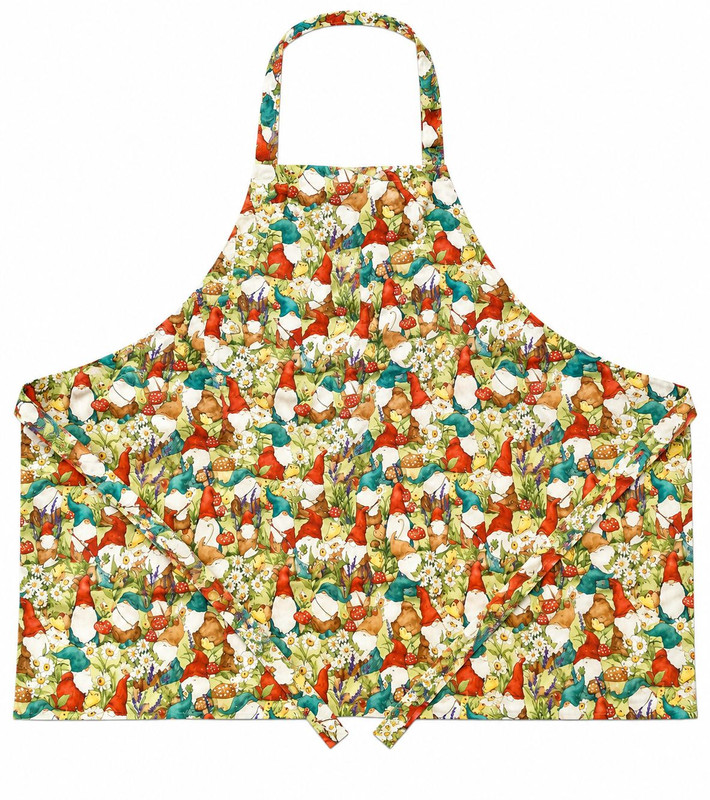 White apron with an all‑over garden gnome print featuring turquoise and red gnome hats, mushrooms, flowers, and greenery with matching straps
