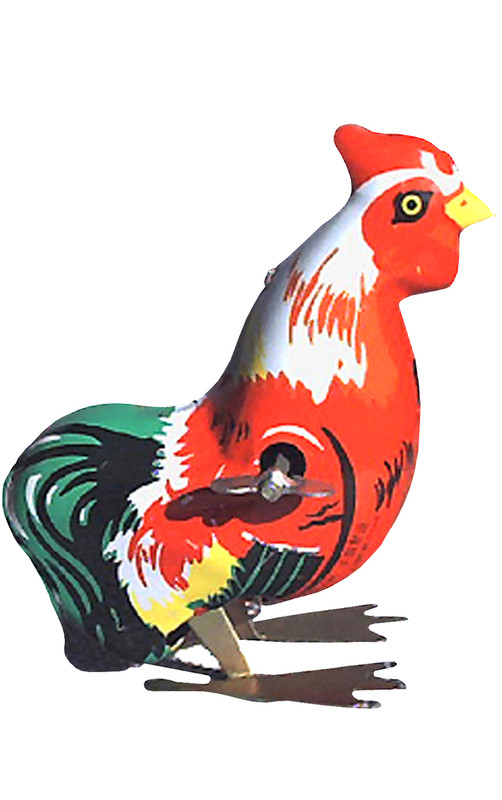 Vintage tin rooster wind‑up toy with bright red, yellow, green, and white feathers