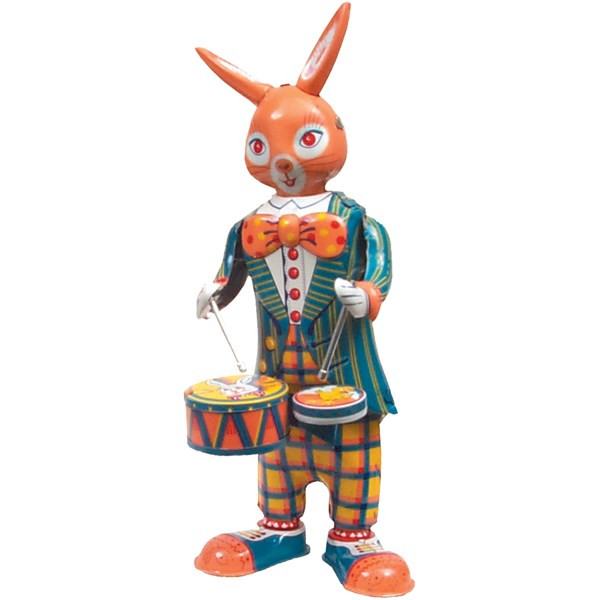 Vintage tin bunny drummer wind‑up toy swaying as he plays his drums