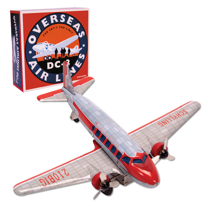 Vintage tin DC3 airplane toy with friction motor and spinning propellers