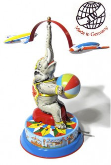 Vintage tin elephant toy balancing a beach ball and spinning airplanes, made by Joseph Wagner