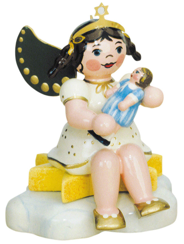 A hand‑painted wooden angel from Hubrig’s Angels of Heaven collection, holding a small doll.