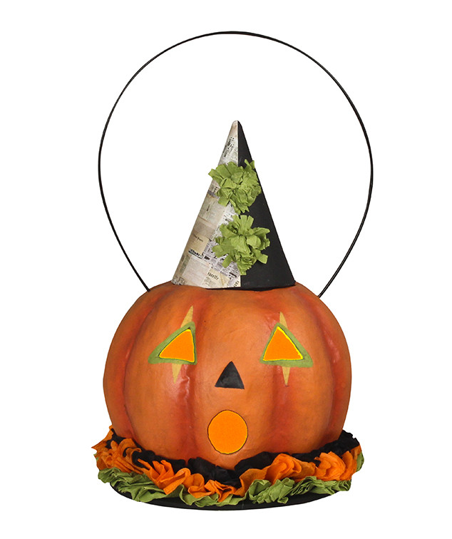“Hand‑painted folktale‑style papier mâché pumpkin lantern with crepe‑paper trim, removable hat, and glowing vellum eyes.”