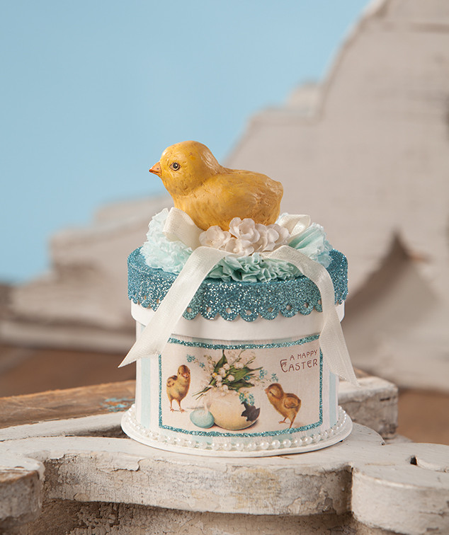 easter chick figure standing on pressed paper box with crepe paper ribbon glitter pearls and floral accents