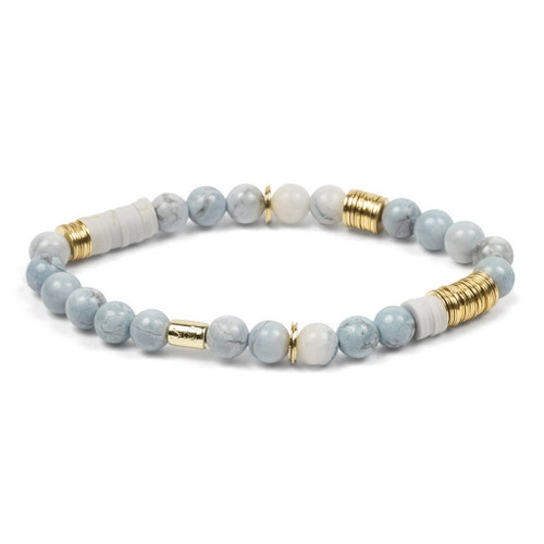 Graceful bracelet featuring soft blue tinted Howlite gemstones paired with white polymer clay discs and gold-plated brass accents on a stretch cord, exuding a sense of harmony and tranquility.