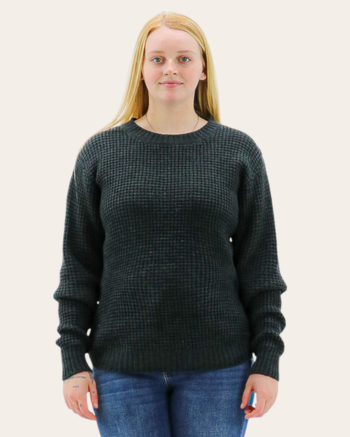 Front view of women’s charcoal waffle knit sweater with crew neck and long sleeves. Front view of women’s charcoal waffle knit sweater with crew neck and long sleeves.