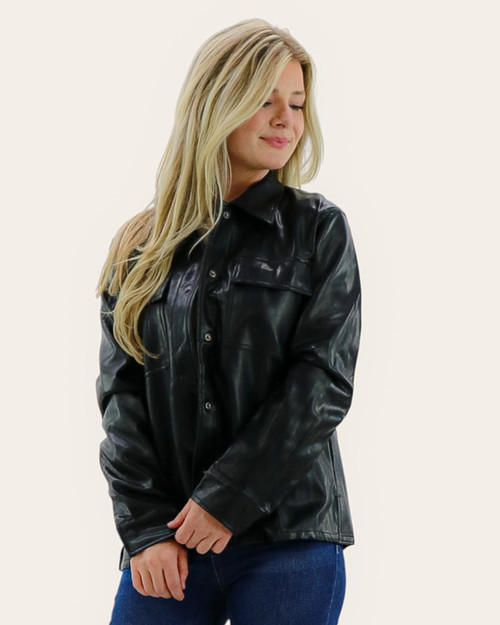 Front view of Mystree faux leather shacket buttoned up, highlighting soft sheen, chest pocket detail, and comfortable casual fit. Front view of Mystree faux leather shacket buttoned up, highlighting soft sheen, chest pocket detail, and comfortable casual fit.