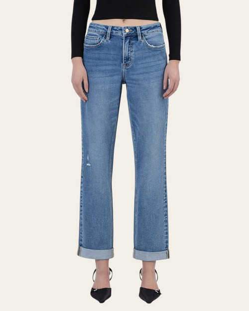 Front view of light wash straight-leg jeans with rolled cuffs and minimal distressing, styled with pointed heels