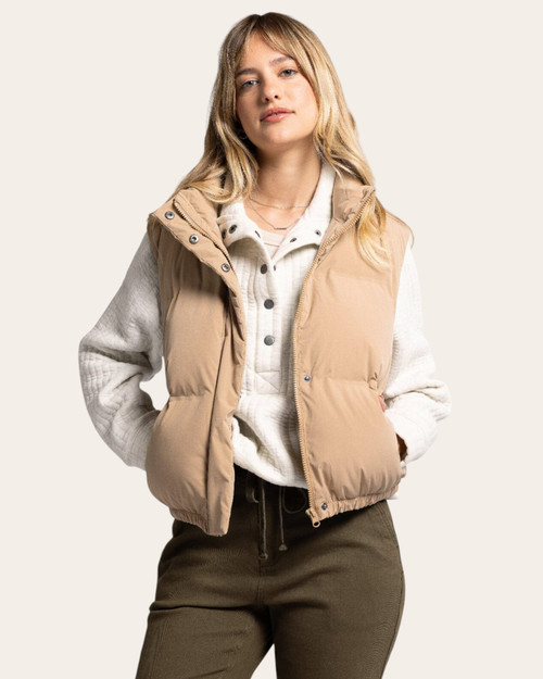 Front view of the Thread & Supply Aspen Vest - Tan featuring zip front closure and side pockets, the perfect tan puffer vest women’s outerwear from Trendy Threads.
