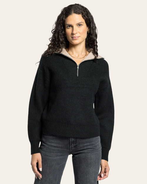 Front view of the Thread & Supply Celia women’s quarter zip sweater in black with contrasting beige collar — cozy fall and winter essential from Trendy Threads Boutique, South Dakota. Front view of the Thread & Supply Celia women’s quarter zip sweater in black with contrasting beige collar — cozy fall and winter essential from Trendy Threads Boutique, South Dakota.