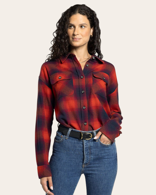 Woman wearing red and navy women’s plaid flannel shirt front view