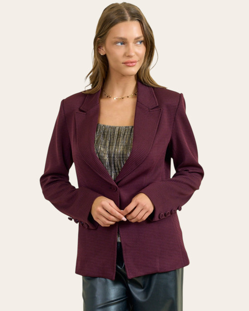 Brandy burgundy notched collar blazer front view buttoned over a metallic top, showing the tailored fit and hip-length coverage.