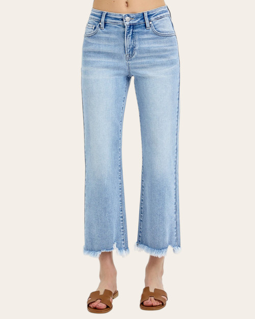 Front view of Risen Jayda straight leg jeans in a light wash with a frayed hem.