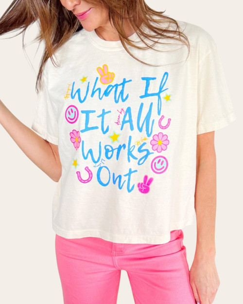 Front view of the What If It All Works Out positive graphic cropped tee styled with bright pink bottoms.