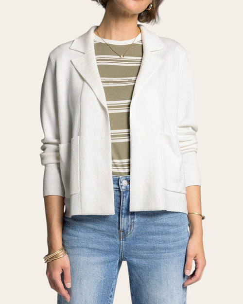 Woman wearing the Ivory Naomi Jacket by Thread and Supply styled with jeans for a casual spring look.