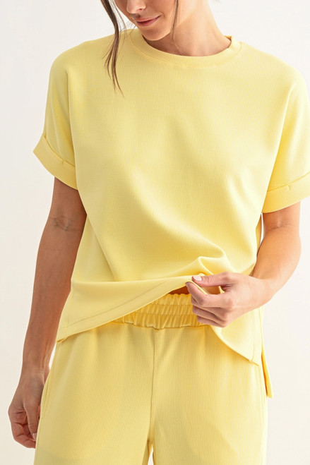 Front view of a bright yellow ribbed short sleeve tee with rolled cuffs from our South Dakota clothing store.