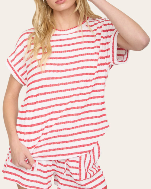 Model wearing the Carla red and white striped knit top, a casual spring arrival at our Roscoe boutique.