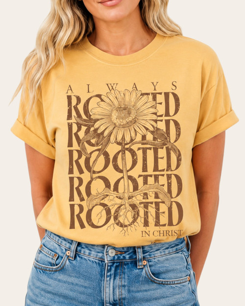 Front view of the Always Rooted in Christ mustard yellow graphic tee featuring a vintage sunflower design.