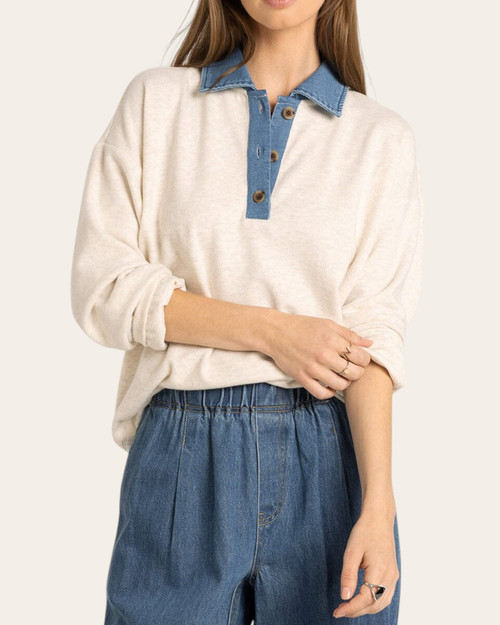 Woman modeling the dreamy soft Thread and Supply Crest Pullover in heather oatmeal with a denim henley neckline.