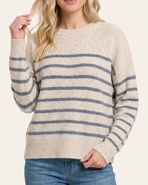Front view of the oversized Creating Memories winter blue striped sweater on a model.
